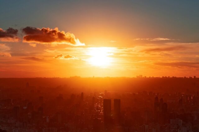 silhouette of city buildings during sunset
