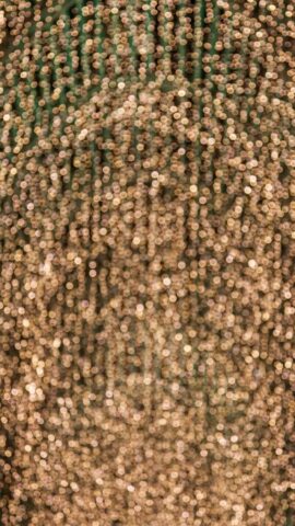 Photo by Cocodillaa.com a close up of a bunch of beads on a wall