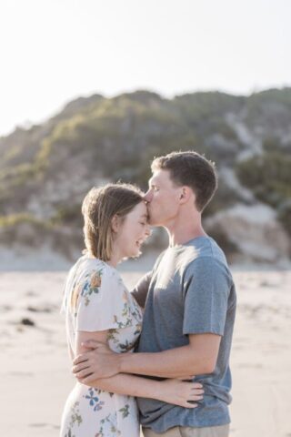 Photo by Cocodillaa.com man kissing a woman on her forehead at shore during daytime