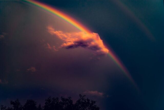 Photo by Cocodillaa.com rainbow on blue sky with gray clouds during daytime