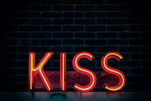 Photo by Cocodillaa.com red Kiss neon signage