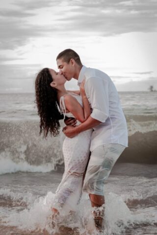 Photo by Cocodillaa.com man and woman kissing on beach during daytime