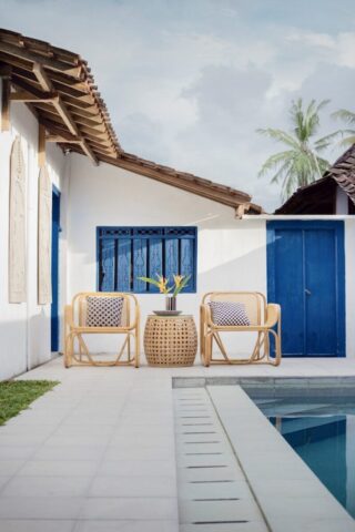 photo by Cocodillaa.com wicker table and two chairs near swimming pool