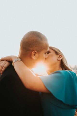 Photo by Cocodillaa.com man in blue shirt kissing woman in black shirt