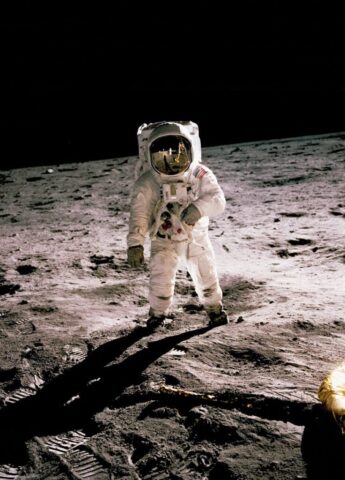 Photo by Cocodillaa.com astronaut standing on gray sand