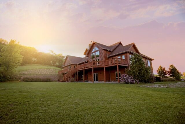 photo by Cocodillaa.com brown wooden house with green grass field