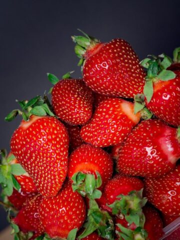 red strawberries in blue container