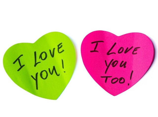 Two heart-shaped notes express love and affection.