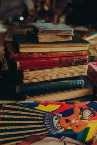 a stack of books sitting on top of a table