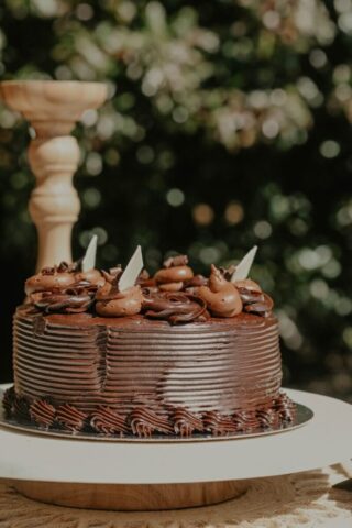 Photo by Cocodillaa.com a chocolate cake sitting on top of a white plate