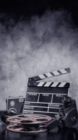 Photo by Cocodillaa.com a video camera on a tripod on a white background