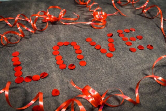 the word sale spelled out with red confetti