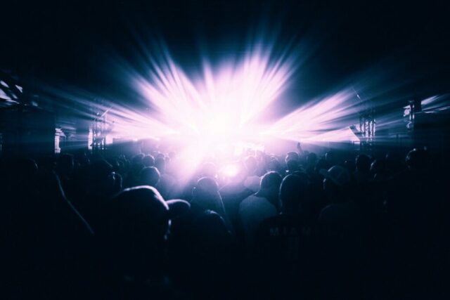 Photo by Cocodillaa.com group of people near LED light inside room