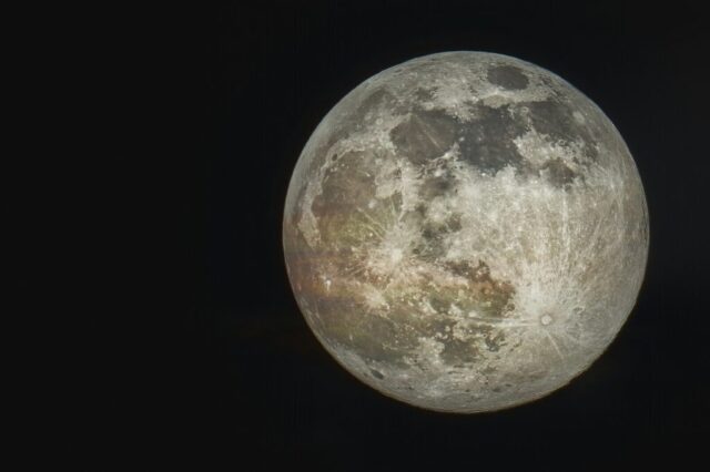 Photo by Cocodillaa.com full moon on black background
