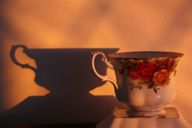 A coffee cup sitting on top of a table