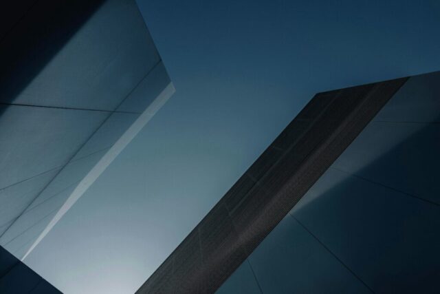 a tall building with a sky in the background