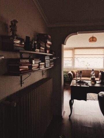 books on brown wooden shelf