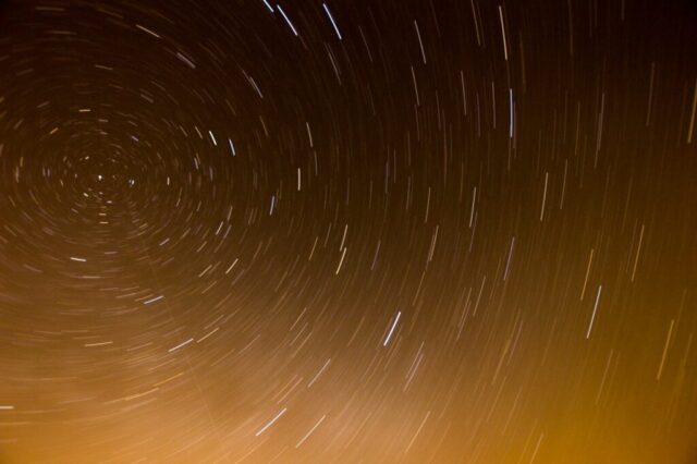 a star trail is seen in the night sky a star trail is seen in the night sky