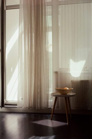 photo by Cocodillaa.com white window curtain near brown wooden table