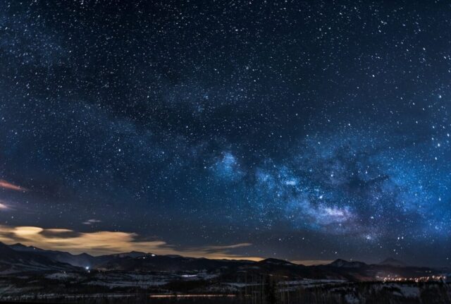 mountains with trees under white star at night mountains with trees under white star at night