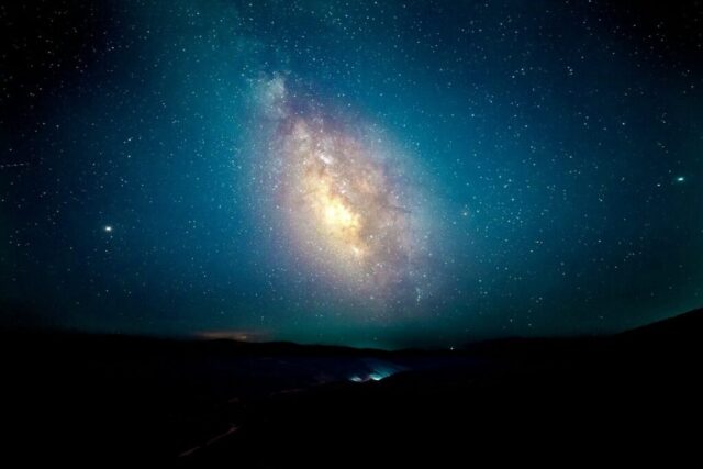 silhouette of mountains under starry sky during nighttime silhouette of mountains under starry sky during nighttime