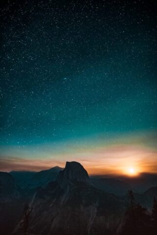 high-angle photography of mountain at sunset high-angle photography of mountain at sunset