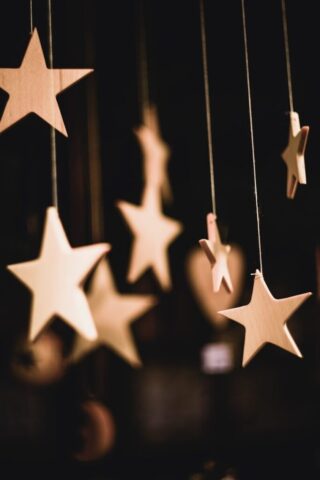 shallow focus photo of wooden stars hanging decor shallow focus photo of wooden stars hanging decor