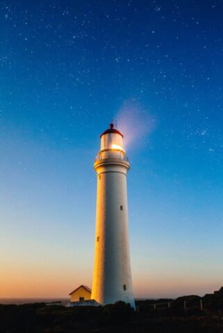 white concrete lighthouse white concrete lighthouse