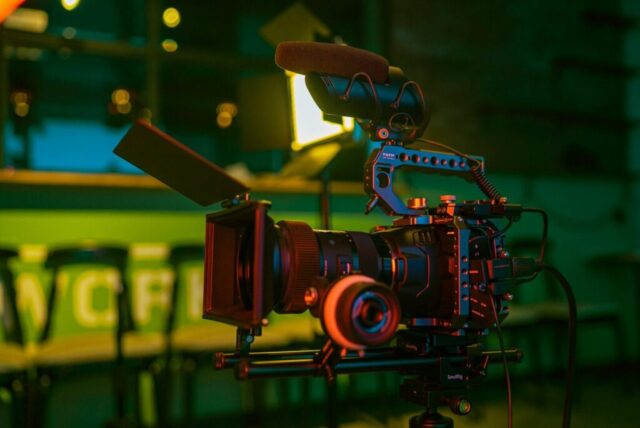 Photo by Cocodillaa.com black and red camera on green table