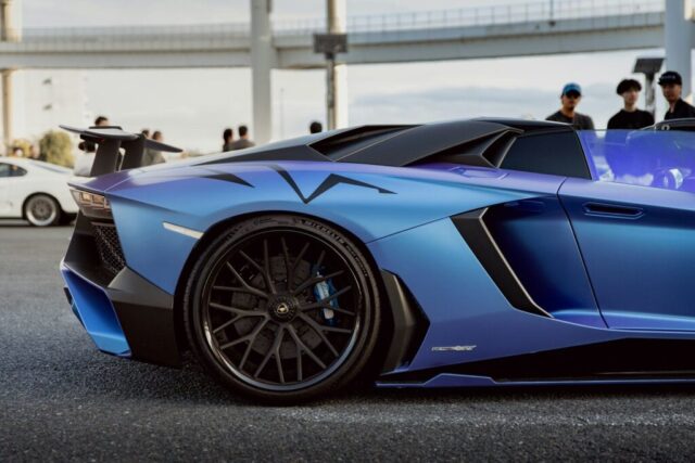 Blue sports car with a spoiler and spoiler