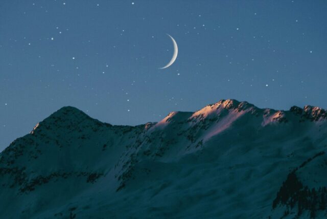 crescent moon above mountain crescent moon above mountain