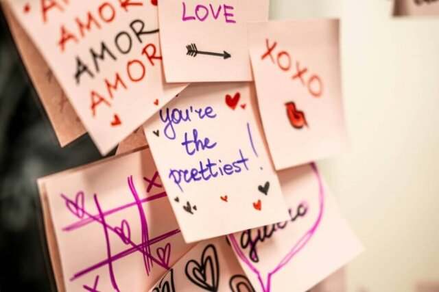 A bunch of post it notes with writing on them