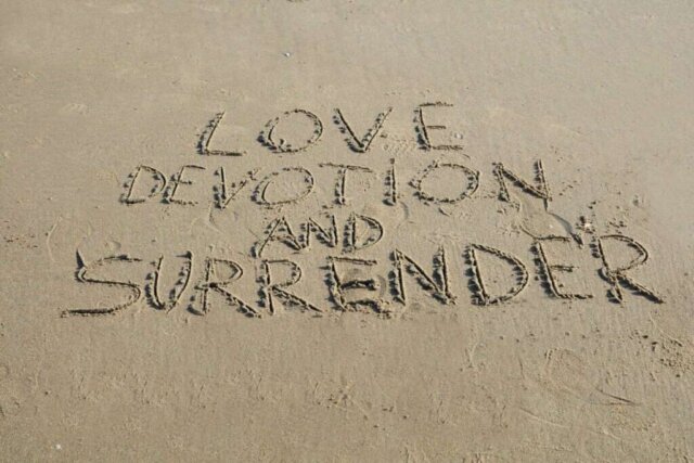 Love, devotion and surrender are written in sand.