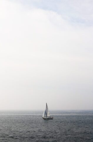 boat sailing in body of water