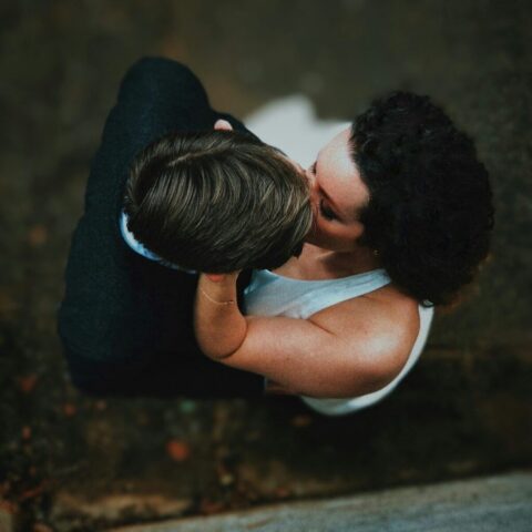 Photo by Cocodillaa.com a woman kissing a man on the cheek