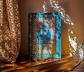 a picture frame sitting on top of a wooden table
