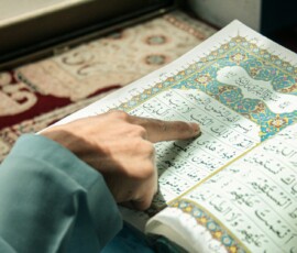 a hand pointing to a map